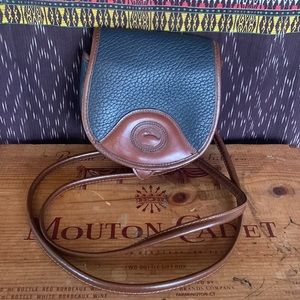 Dooney & Bourke crossbody belt bag
All weather leather navy